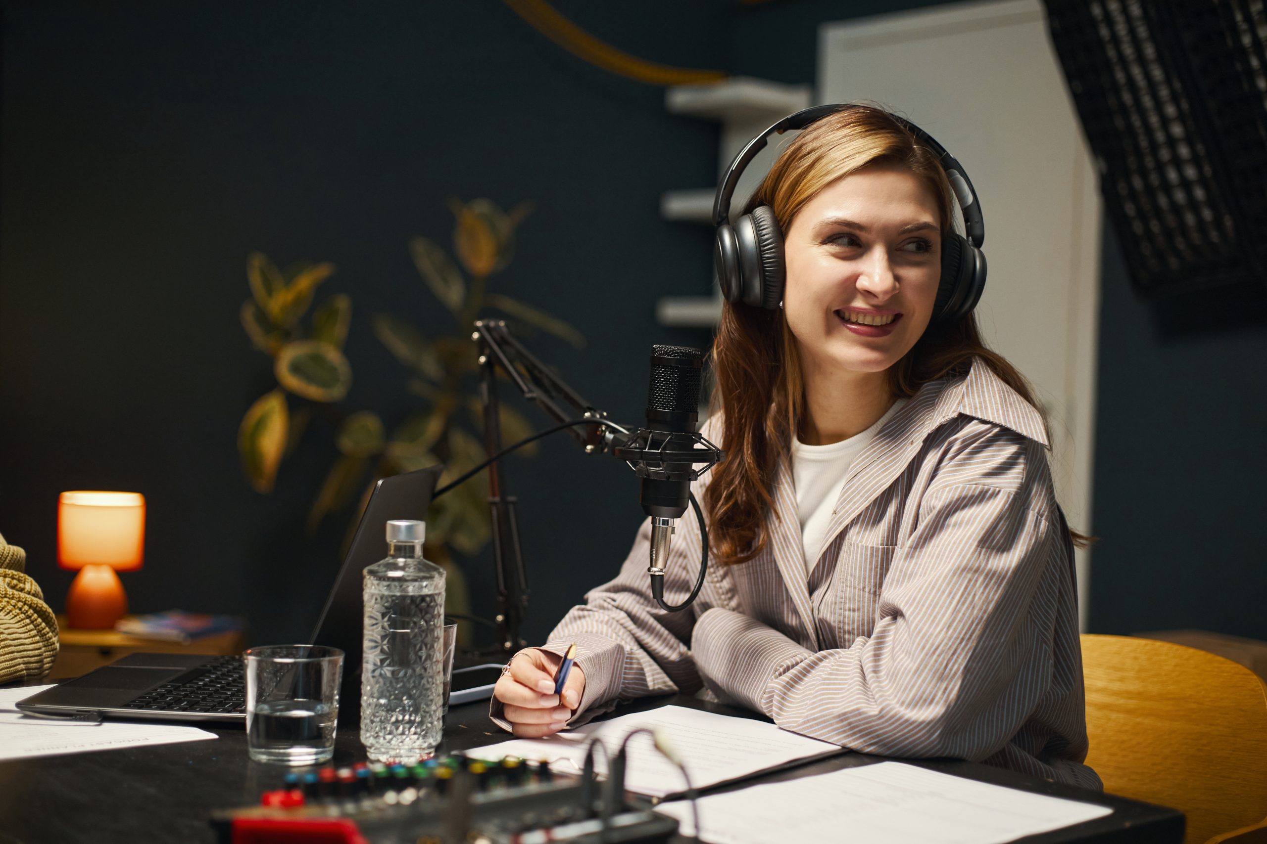 Woman Recording Podcast In Studio